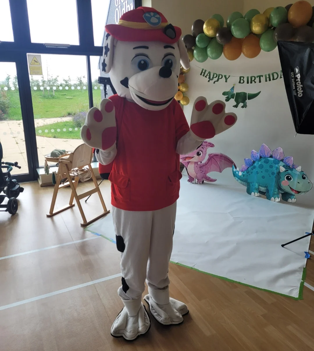 Character mascot with a child at an outdoor party